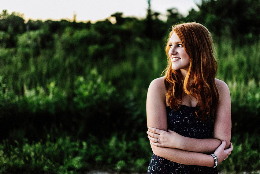 redhead senior girl out on a country road