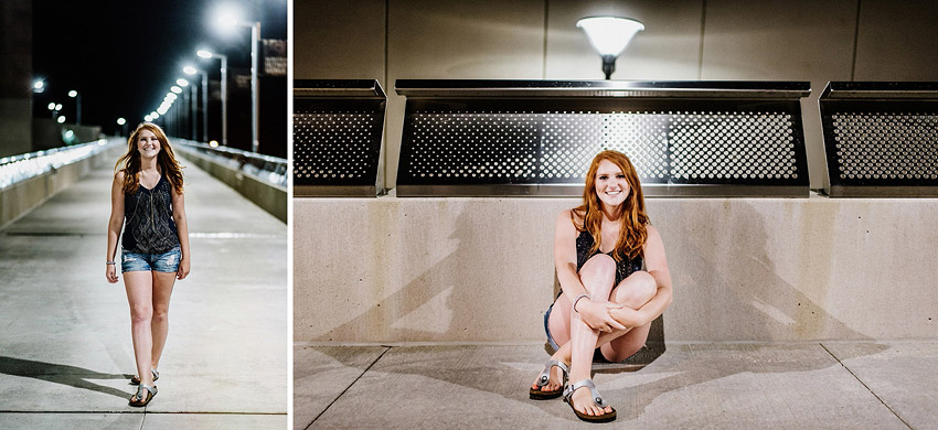 redhead senior girl walking and sitting downtown on a bridge at night