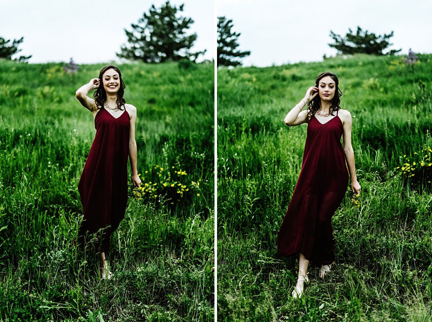 a girl in a red dress walking in a field