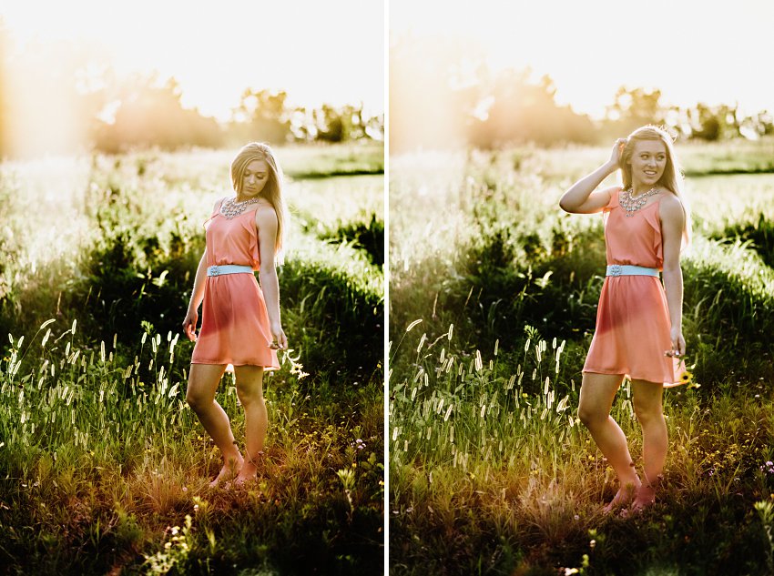 girl in a pink dress in a hazy sunset standing in tall grass