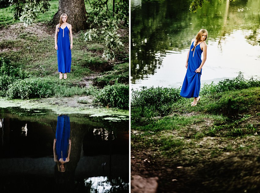 girl in a long blue dress standing by the edge of water