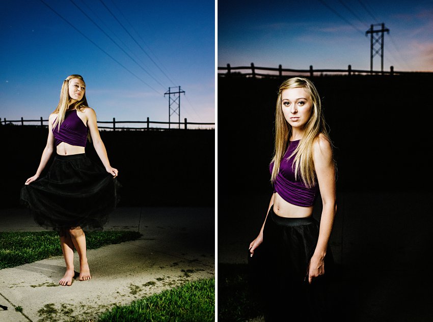 girl in a purple top and black skirt at dusk out in the country
