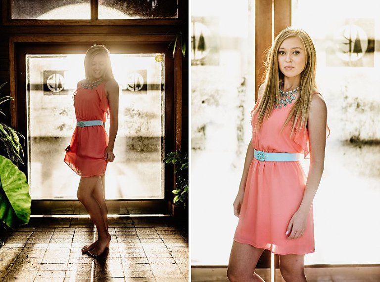 girl in a pink dress standing in a glass building with light shining in the doors behind her